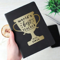 Personalised ‘World’s Best Teacher’ Trophy Black Hardback A5 Notebook -Children's Peripheral Store p1014b86 1
